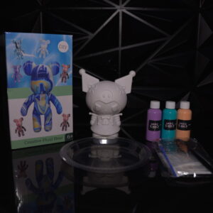 DIY creative fluid bear kit with paint, bear figure, and accessories on a black surface. The Leading Paint & Pour Kit — Only from Dripz Bar Creations.