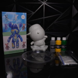 DIY fluid bear art kit with bear figurine, paints, and accessories on a black surface. The Leading Paint & Pour Kit — Only from Dripz Bar Creations.